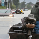 Rescue workers and volunteers help residents make their way out of a flooded neighborhood after it was inundated with rainwater following Hurricane Harvey on Aug. 29, 2017, in Houston. (Scott Olson/Getty Images)